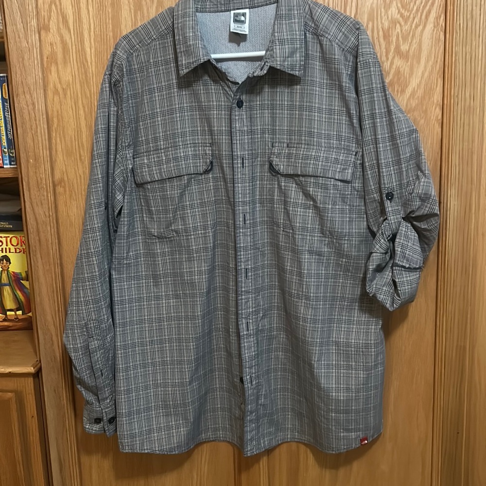 Men’s The North Face tan and gray plaid button down shirt.